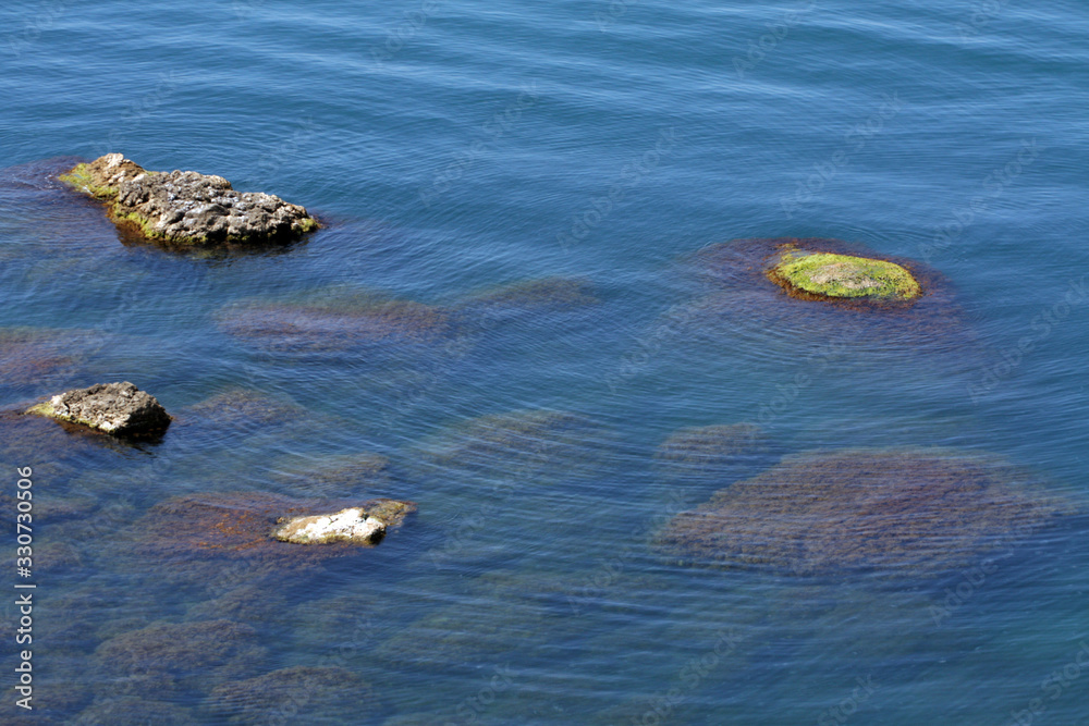 Water Surface And Rocks Stones On Sea bottom Water Surface And Rocks Stones On Sea bottom
