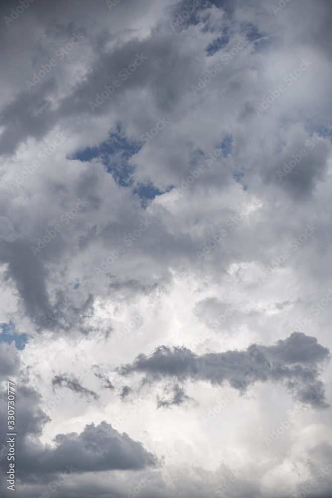 Obraz premium Terrible thunderclouds from the side of a plane. Gloomy epic clouds. Background image in a dark gray style.