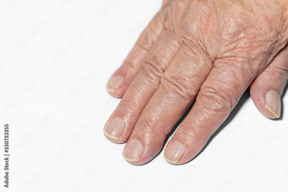 Hand of an old woman on a white background, hand of a grandmother close-up