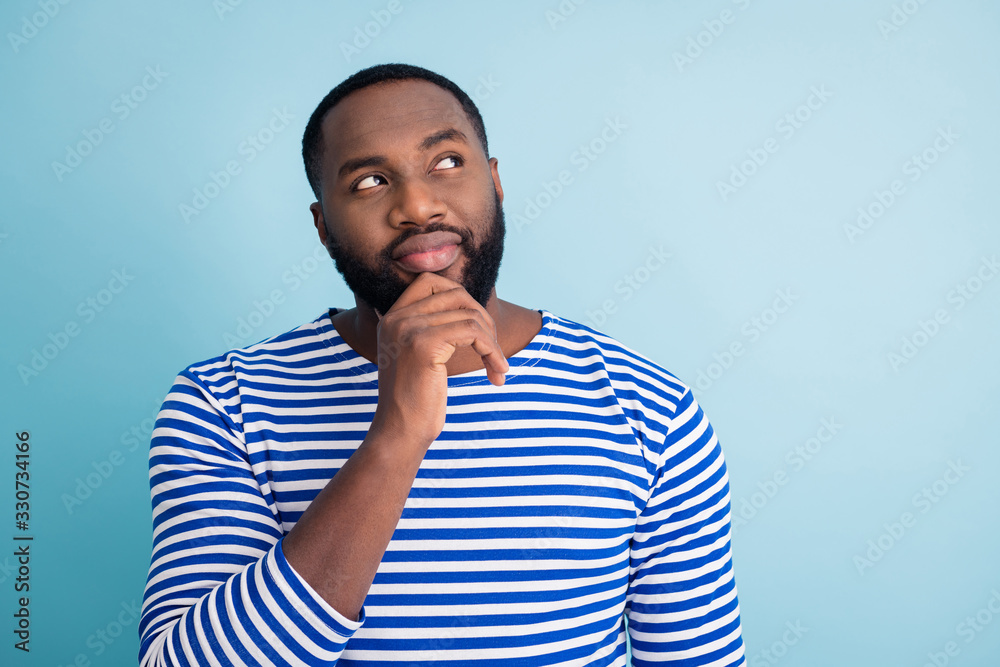 Portrait of minded focused afro american guy think thoughts decide decisions choose choice solution about spring time holidays wear nautical vest frock isolated over blue color background Portrait of minded focused afro american guy think thoughts decide decisions choose choice solution about spring time holidays wear nautical vest frock isolated over blue color background