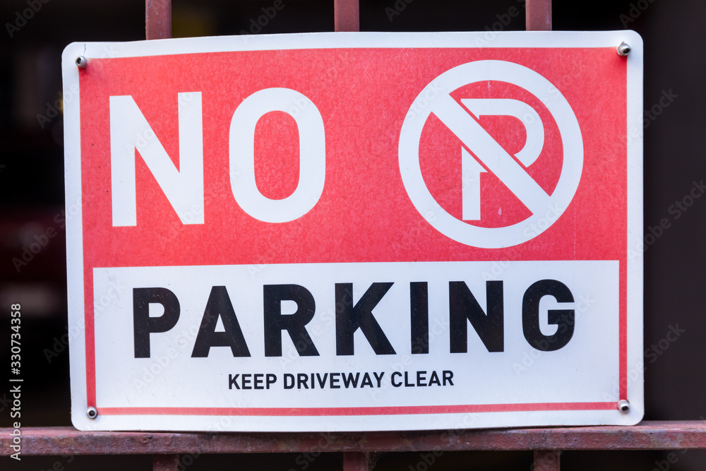 No Parking keep driveway clear sign and Symbol