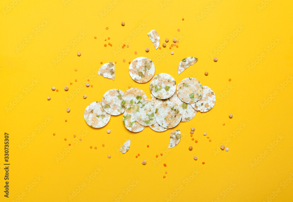 Vegeterian bean chips and lentils on yellow background. Top view. Healthy eating concept. Vegeterian bean chips and lentils on yellow background. Top view. Healthy eating concept.