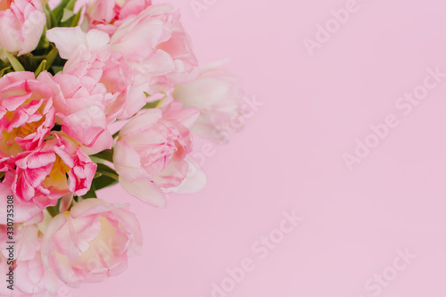 Creative spring background composition colorful flowers on pink background. Minimal top down summer concept. Copy space. Card template © Olga