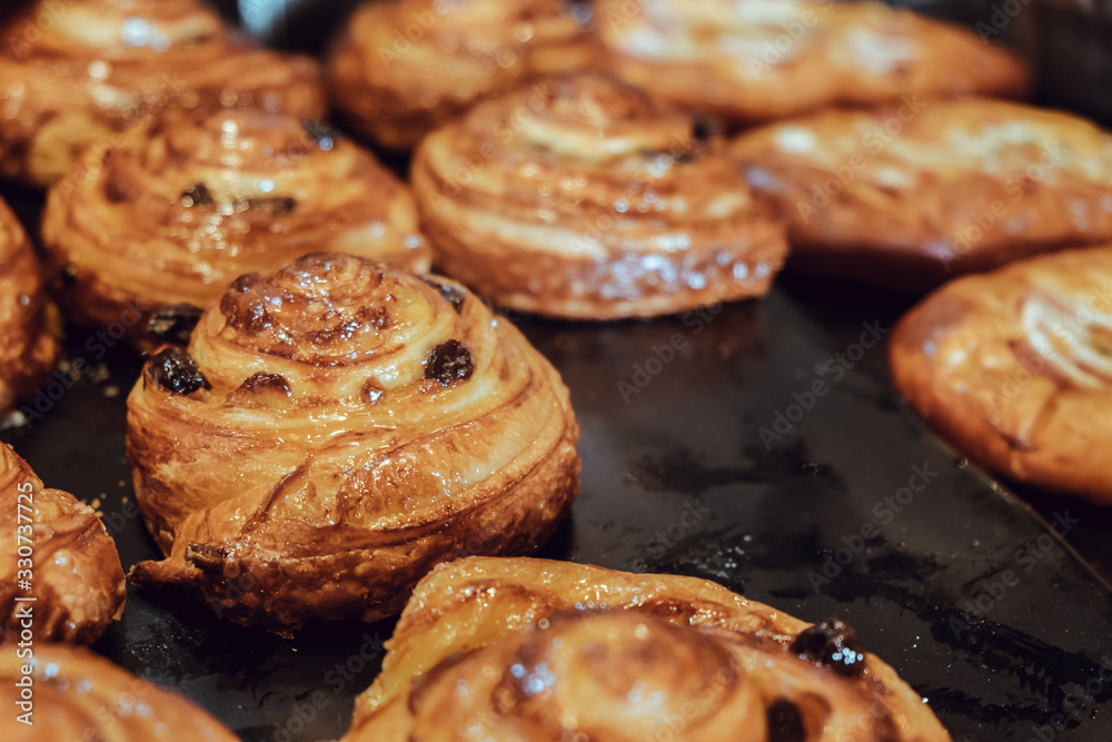 Classic French raisin danish pastry in bakery shop.