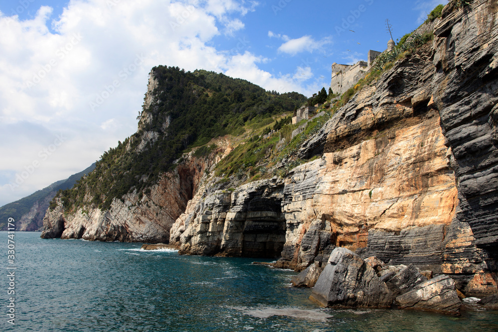Portovenere ( SP ), Italy - April 15, 2017: Cliff around San Pietro Church, Portovenere gulf of Poets, Cinque Terre, La Spezia, Liguria, Italy