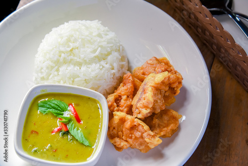 Deep Fried Chicken  and Green Curry with Rice , vegetable  in White plate. Thai food photo