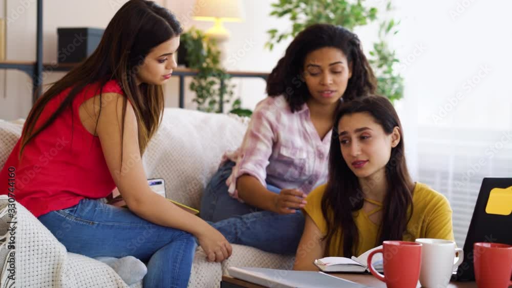 Caring friends cheering up their roommate in difficult situation Caring friends cheering up their roommate in difficult situation