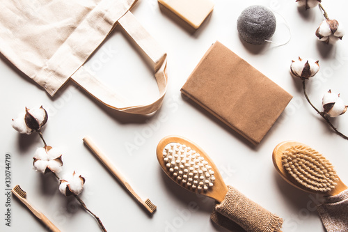 Natural brushes made of wood and soap on the background of concrete, bamboo toothbrushes PNOV2019