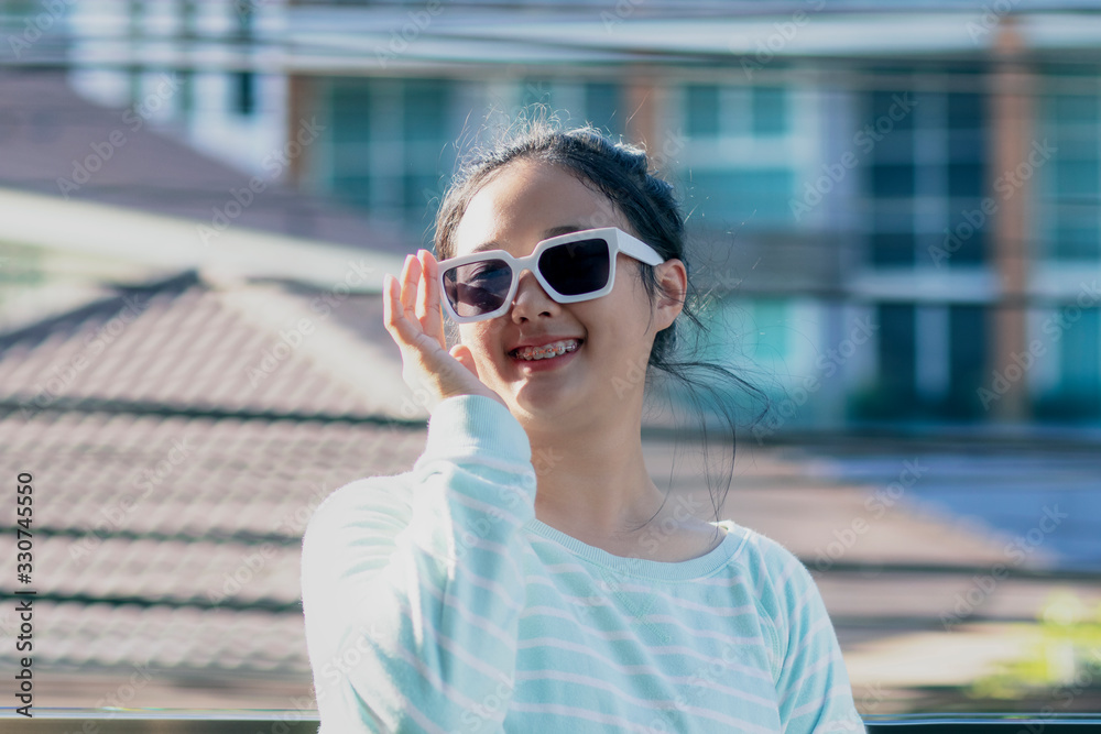 toothy smiling face of asian teenager show braces teeth toothy smiling face of asian teenager show braces teeth