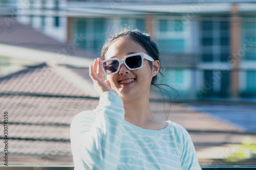 toothy smiling face of asian teenager show braces teeth