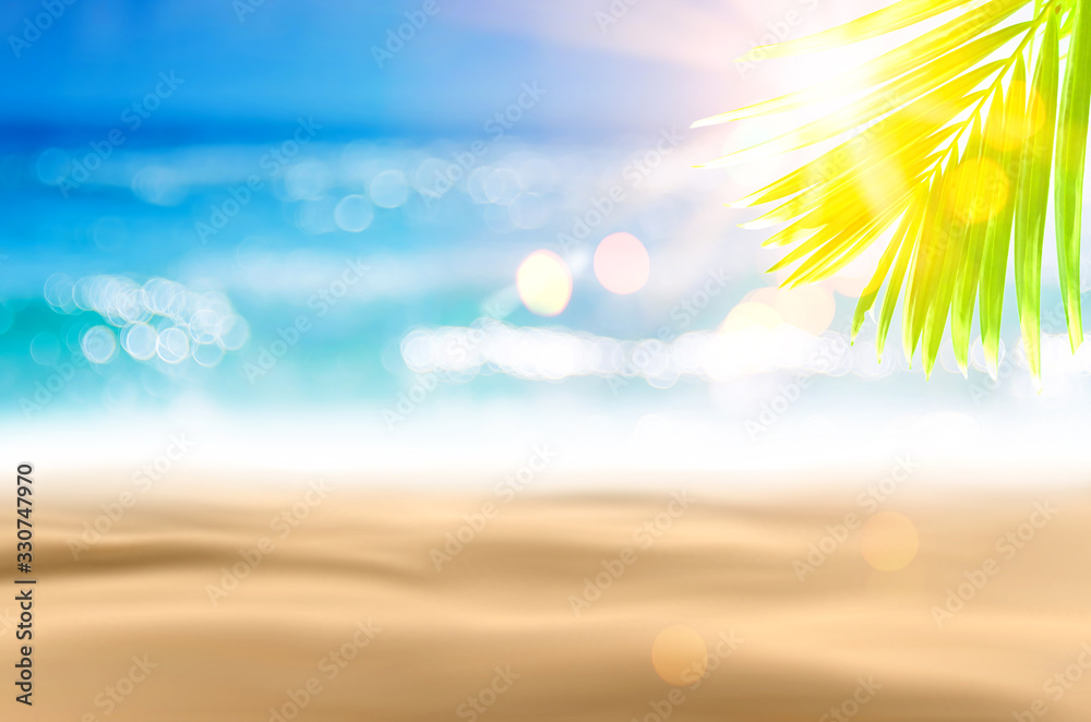 Blur beautiful nature green palm leaf on tropical beach with bokeh sun light wave abstract background. Blur beautiful nature green palm leaf on tropical beach with bokeh sun light wave abstract background.
