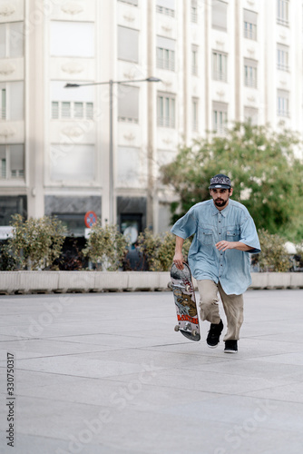 Man Skateboarding In The City