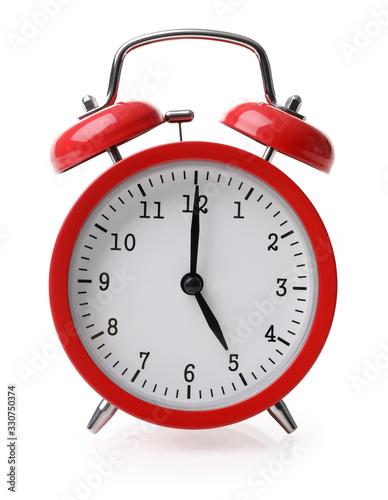 Red alarm clock set at five isolated over white background photo