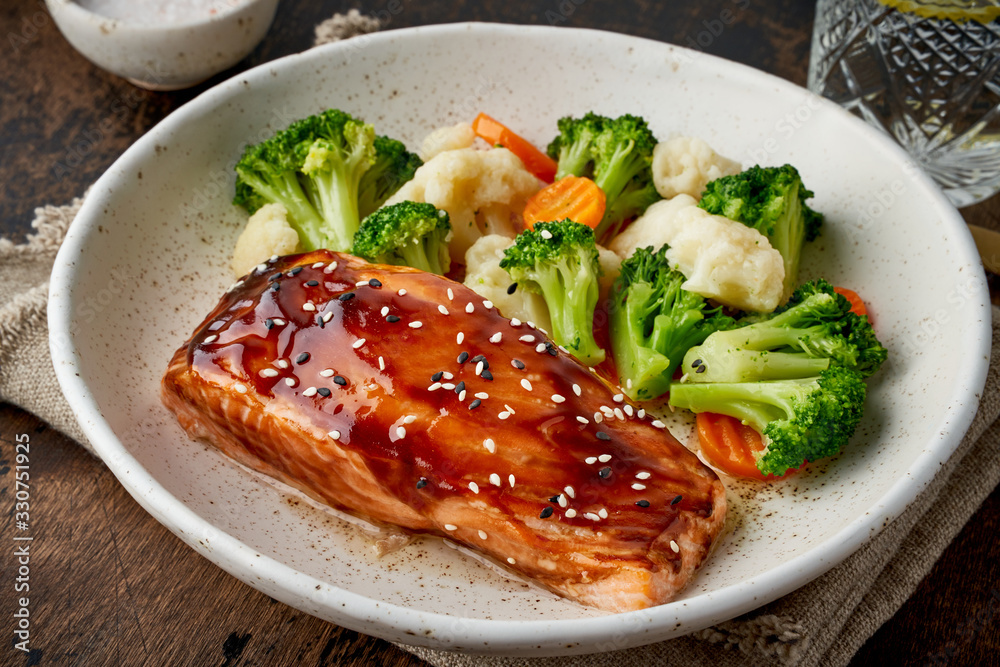 Steam salmon and vegetables, Paleo, keto, fodmap, dash diet. Mediterranean food with steamed fish. Steam salmon and vegetables, Paleo, keto, fodmap, dash diet. Mediterranean food with steamed fish.