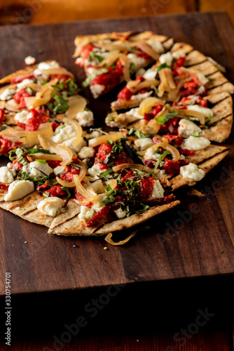 Wallpaper Mural Pizza. Classic traditional Italian entrée favorite. New York Style Pizza with marinara sauce and topped with mozzarella cheese, meats and fresh vegetables. Baked in wood burning oven Torontodigital.ca