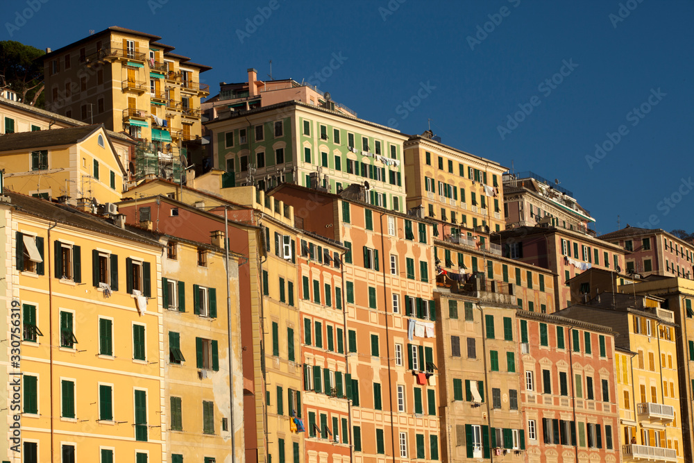 Camogli (GE), Italy - June 01, 2017: Colourful houses in the fishing village of Camogli, Gulf of Paradise, Portofino National Park, Genova, Liguria, Italy