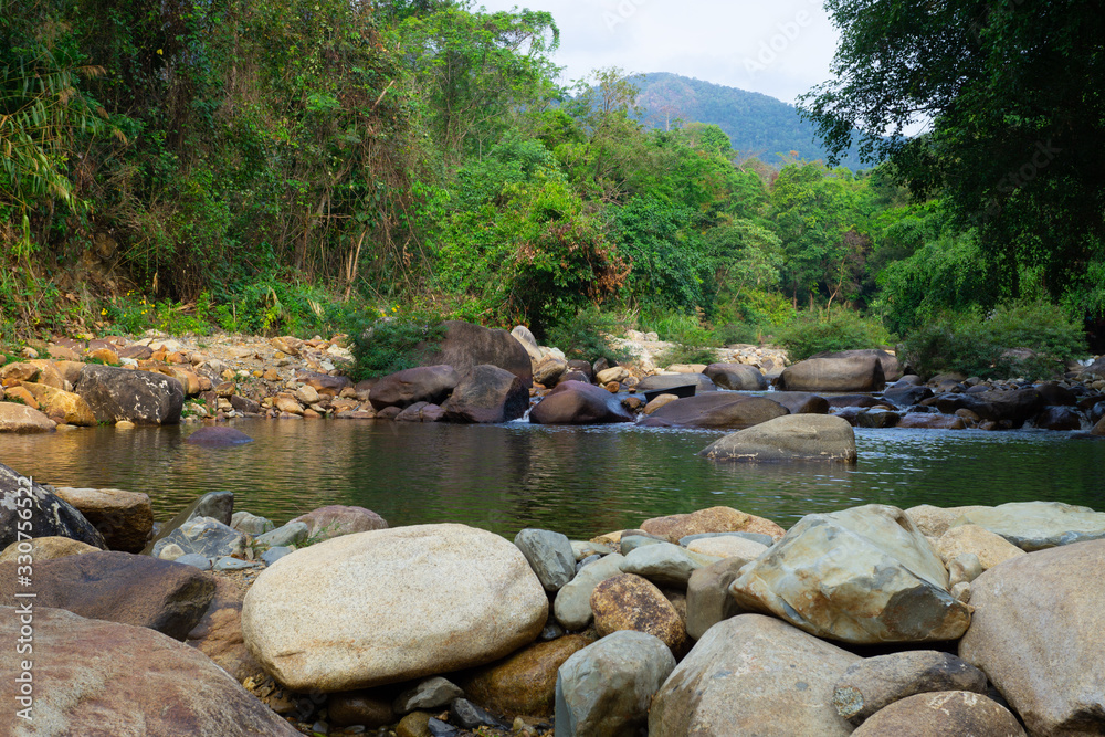 Pond of waterfall with tropical green forest. Pond of waterfall with tropical green forest.