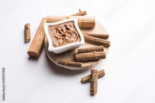 Ayurvedic Liquorice sandalwood Face Mask made using Mulethi or jeshthamadh and Chandan powder. selective focus photo