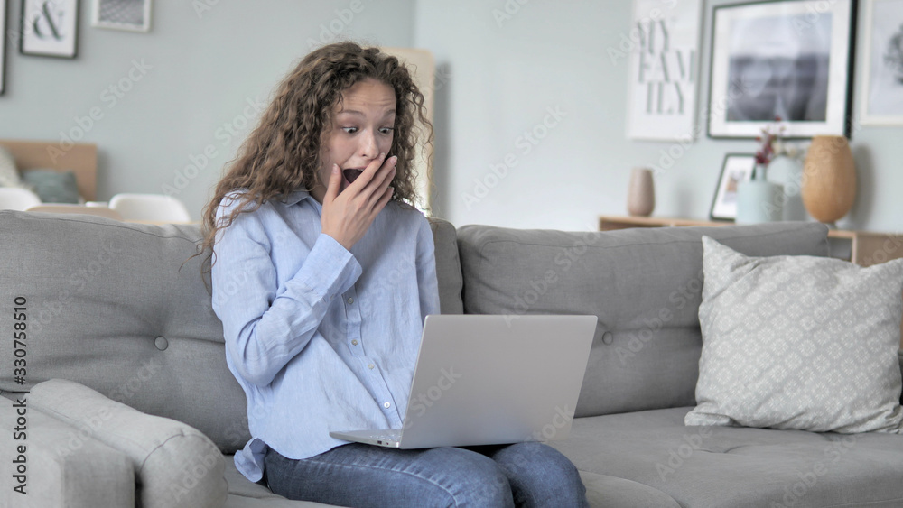 Curly Hair Woman Celebrating Success on Laptop