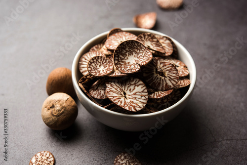 Betel nut chips in a bowl also known as slices of supari in india, used in Paan masala photo