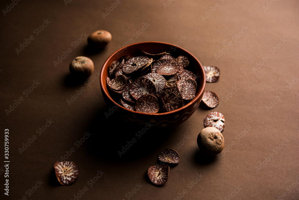 Betel nut chips in a bowl also known as slices of supari in india, used in Paan masala Betel nut chips in a bowl also known as slices of supari in india, used in Paan masala