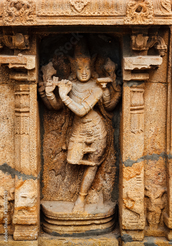 Krishna bas relief in Hindu temple. Sri Ranganathaswamy Temple. Tiruchirappalli, Tamil Nadu, India photo