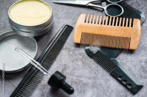 Different combs, brush and other tools for grooming a beard. Close up view.