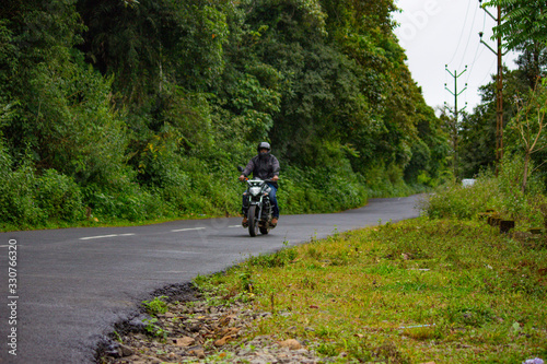 A bike travelling in a mountainous road in tamil nadu india