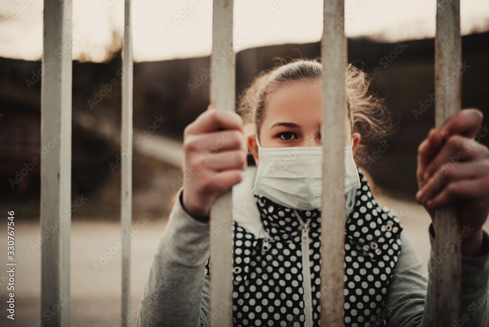 Obraz premium Coronavirus and Air pollution pm2.5 concept.Little girl wearing mask for protect pm2.5.Kid girl imprison at home for protection corona virus.Wuhan coronavirus and epidemic virus symptoms.