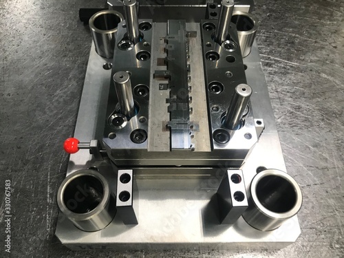 Fotografija Sheet metal stamping tool die on the repair table