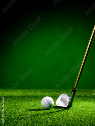 Golf club and golf ball on the turf
