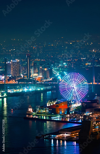 Aerial view of the Osaka Bay harbor area with the ferris wheel at night