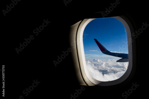 Airplane wing in clouds. Travel concept. 