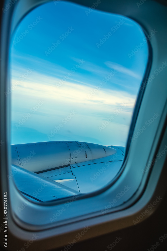 Naklejka premium Blue sky seen from an airplane window