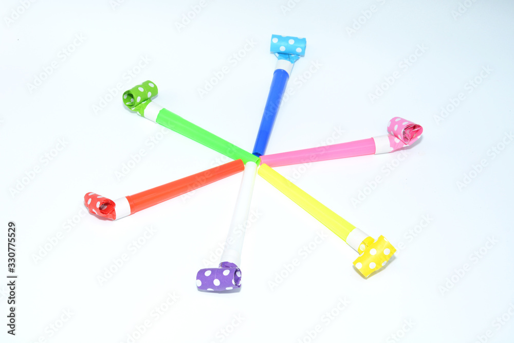 Objects for celebrating a birthday . Whistles and tongues for merry holidays.Holiday concept Objects for celebrating a birthday . Whistles and tongues for merry holidays.Holiday concept