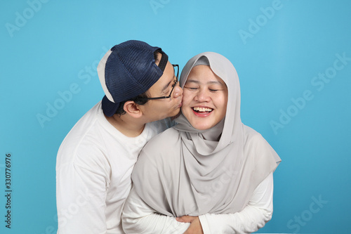 Happy Asian Muslim Couple, Husband Kiss Wife