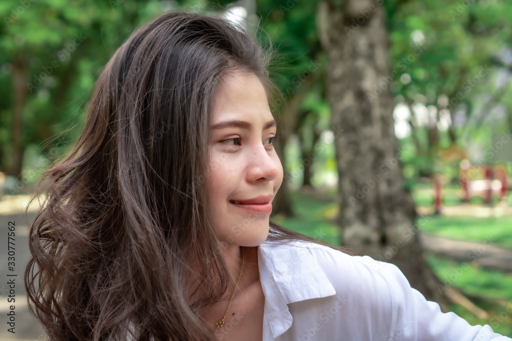 Beautiful Asian women with long hair wearing a white shirt. White bug hat, jeans showing emotions In the nature park-09.jpg, Asian beautiful woman with yellow skin, long black hair, wearing a white s Beautiful Asian women with long hair wearing a white shirt. White bug hat, jeans showing emotions In the nature park-09.jpg, Asian beautiful woman with yellow skin, long black hair, wearing a white s