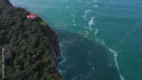 San Emeterio Lighthouse, Landscape in the surroundings of the cave of the Pindal, lighthouse and hermitage of San Emeterio, Cantabrian Sea, Asturias, Spain, Europe photo