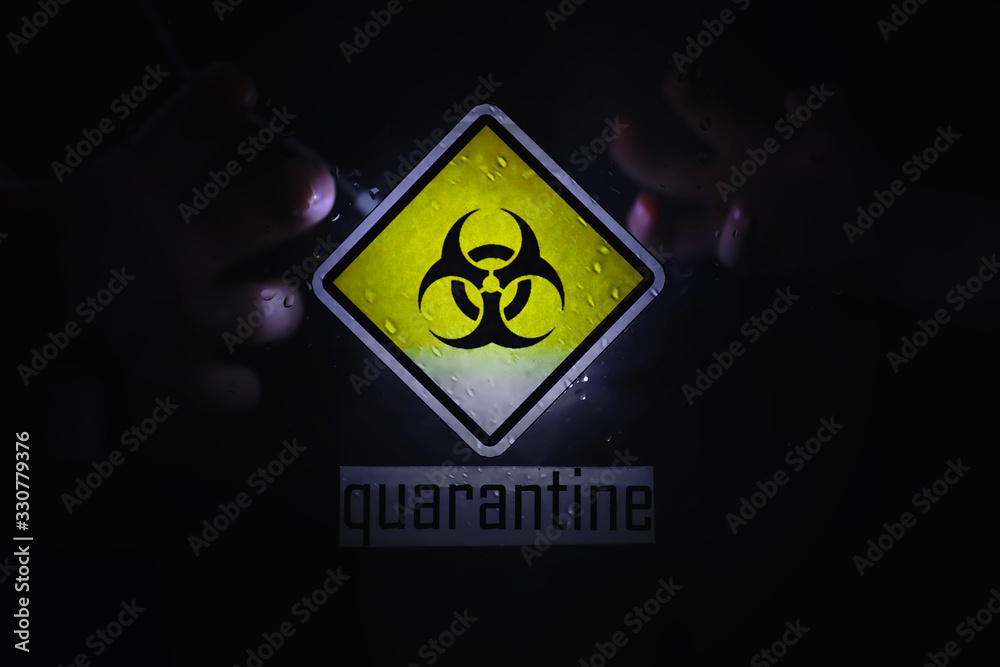 Quarantine. Quarantine warning sign on a glass door in a hospital isolator. Isolation of patients with the virus in special laboratories. Virus. Quarantine. Quarantine warning sign on a glass door in a hospital isolator. Isolation of patients with the virus in special laboratories. Virus.