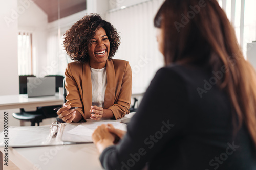Female financial advisor consulting a client photo