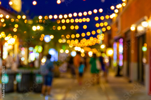 blur image of night festival in a restaurant and market street walk