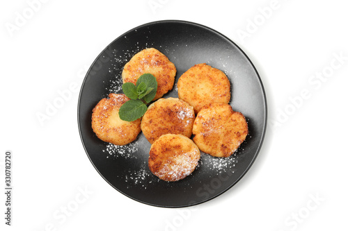 Plate with cheese pancakes and mint isolated on white background