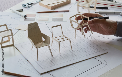 Designer sketching drawing design development product plan draft chair armchair Wingback Interior furniture prototype manufacturing production. designer studio concept . photo
