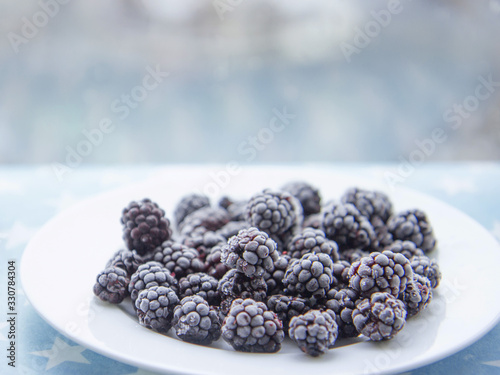 Frozen blackberry on plate
