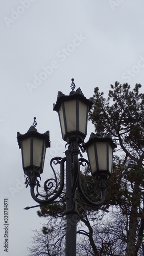 street lamp in front of old building © Viktor Kozyr'