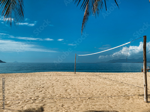 Beach volleyball court on the sandy shore near the sea