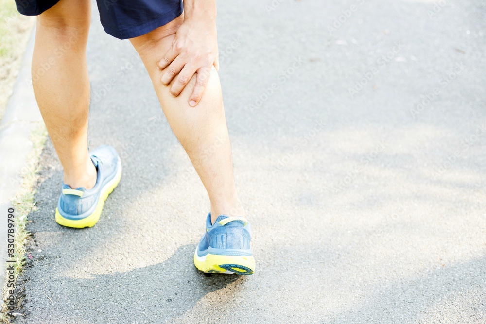 Men have knee pain in the park. Men have knee pain in the park.
