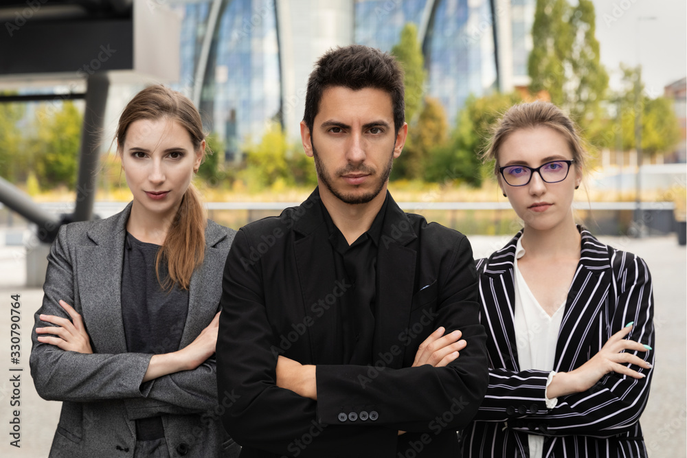 Business partners on the background of an office building. Business partners on the background of an office building.