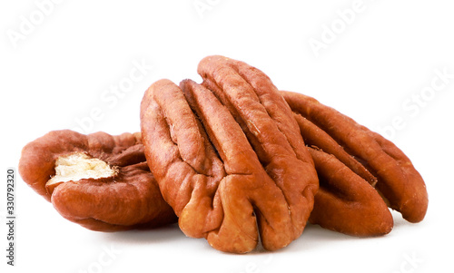 Peeled pecan nuts close-up on a white. Isolated