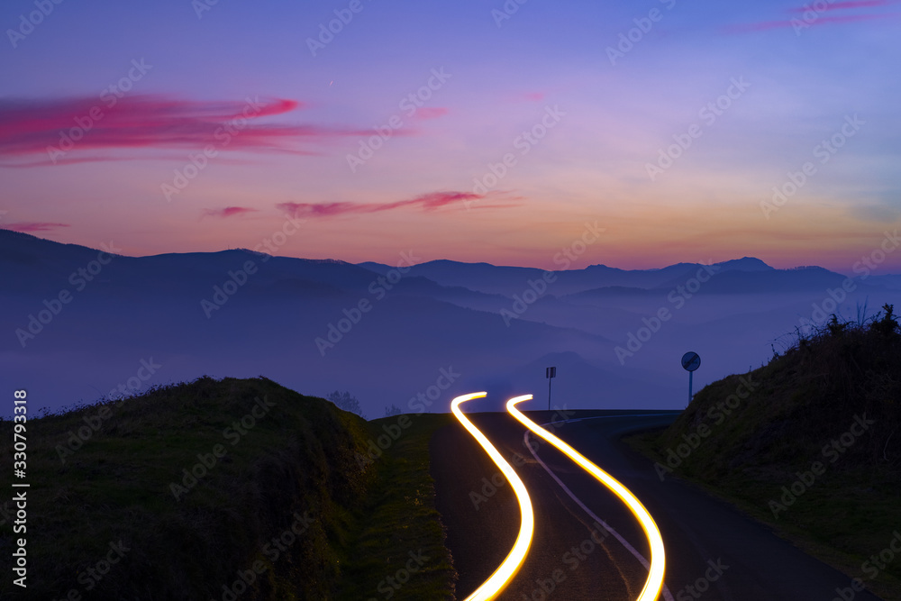 Car Light Trails on mountain road at night